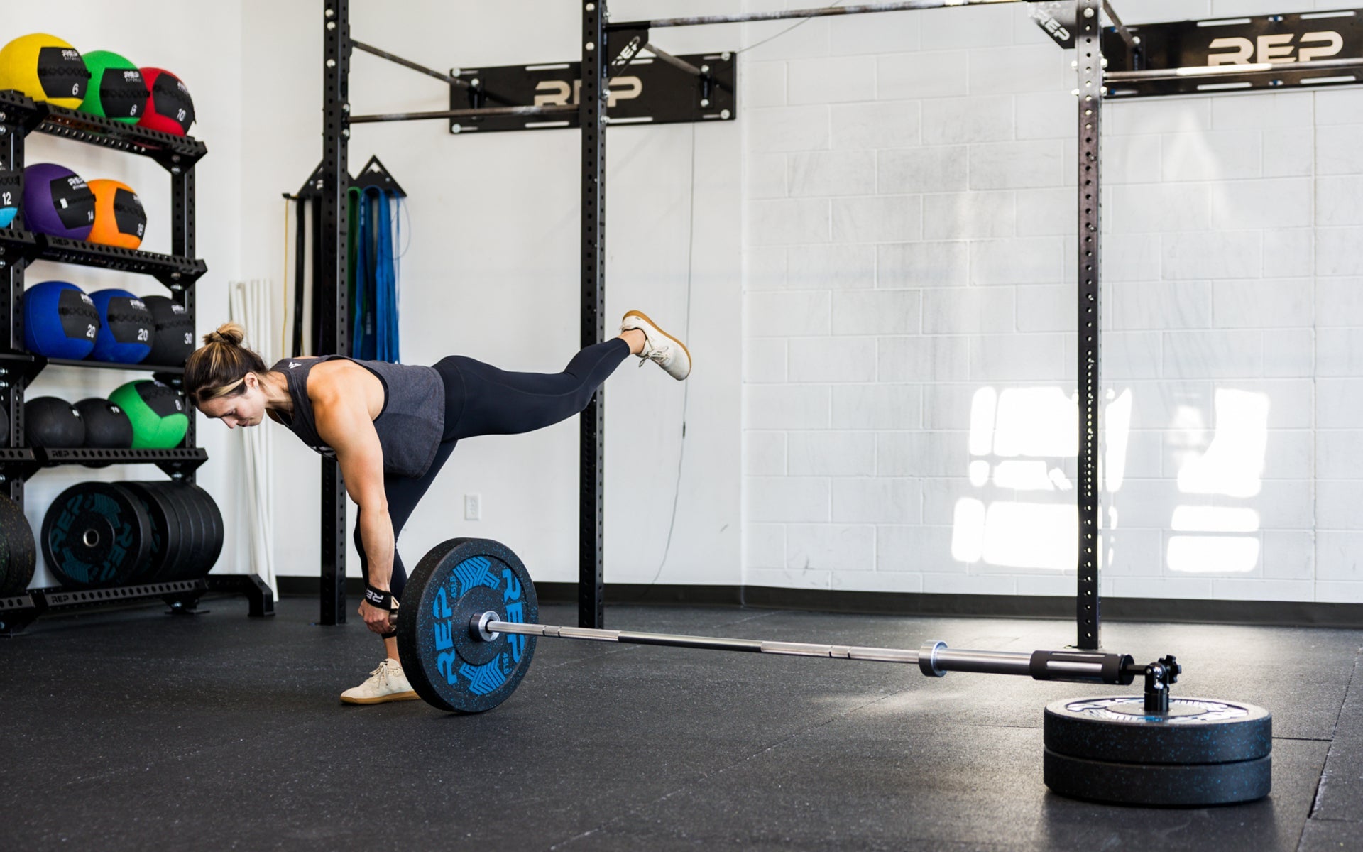 An athlete performing single leg RDLs with the Free Standing REP® x Kleva Built® Adroit Landmine
