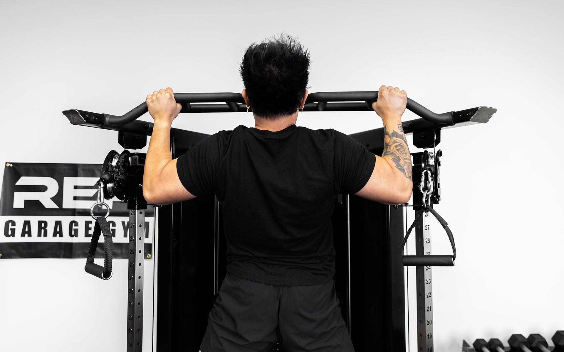 Arcadia™ Functional Trainer being used for pull-ups with the multi-grip bar